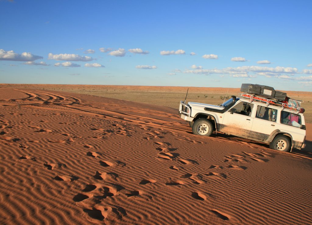 4wd climbing a hill in outback